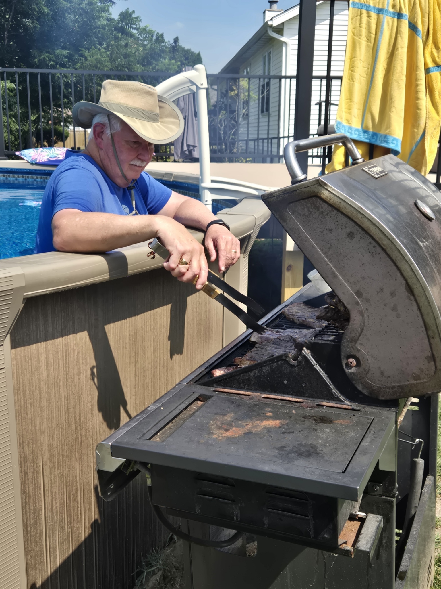 Original PoolBQue setup showing a poolside barbecue closeup