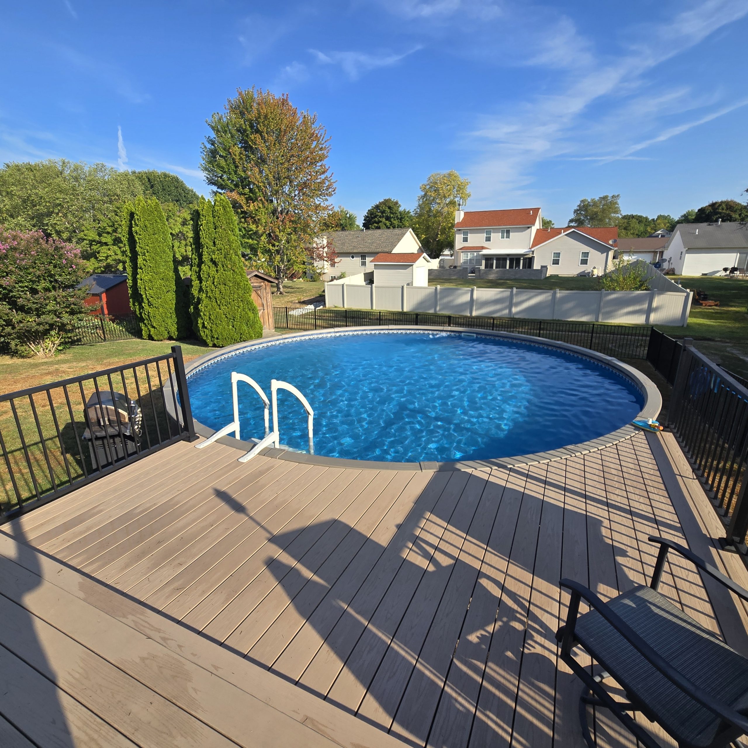 24-foot above-ground pool from Watson's. It's 52" high and holds 13,500 gallons of water. Great product, remarkable service, at a fair price. www.watsons.com